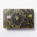 Celestial Eye luxury metal card with ornate engraved artwork in matte black and gold finish