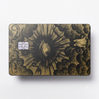 Celestial Eye luxury metal card with ornate engraved artwork in matte black and gold finish